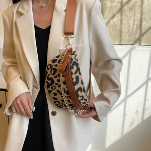 Leopard print linen crossbody bag with brown leather trim and stylish chain strap