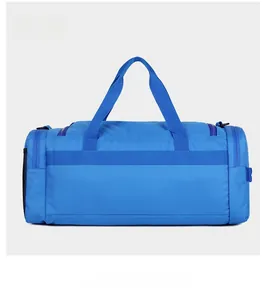 Vue arrière du sac de sport bleu roi montrant les poignées et la poche filet latérale