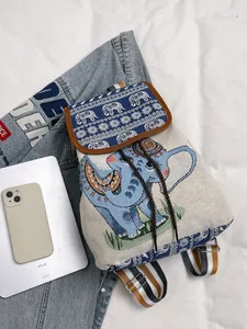 Ethnic style canvas drawstring backpack featuring embroidered blue elephant patterns