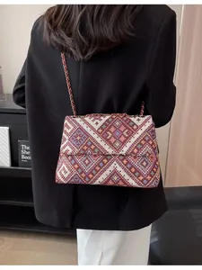 Bohemian large capacity woven shoulder bag with geometric patterns and metal chain strap