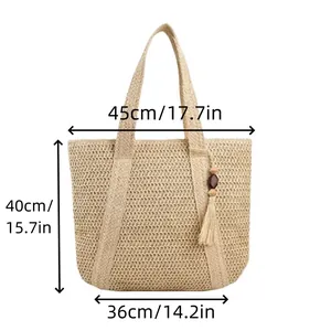 Straw beach tote bag with fringe and dimensions showing natural woven crescent style