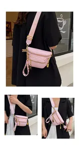 Dettaglio borsa pettorale rosa in pelle litchi con multitasche e catene dorate