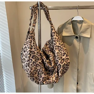 Detail of hobo bag featuring leopard print, adjustable strap and large capacity