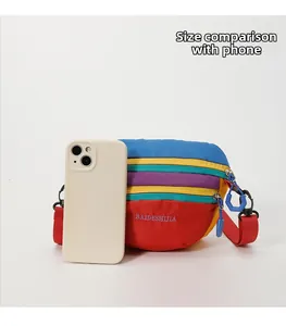 Detailed size comparison of a colorful nylon waist bag next to a smartphone