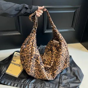 Large leopard print tote bag with wide strap and zip closure for modern commute