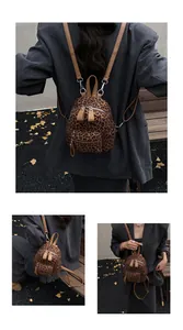 Detailed views of a trendy mini leopard print backpack with silver zippers and adjustable straps