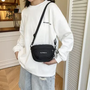 Black waterproof nylon crossbody bag with adjustable strap and logo for outdoor sports