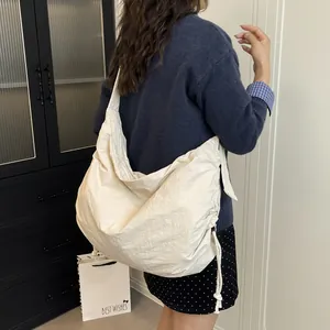 Minimalist beige large capacity nylon crossbody bag with drawstring side detail