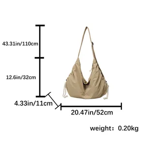 Large khaki nylon dumpling crossbody bag with adjustable strap and size dimensions
