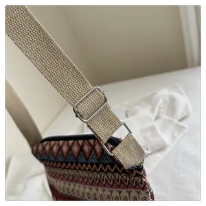 Detail of bohemian jacquard crossbody bag showing woven texture and adjustable metal buckle