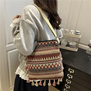 Bohemian geometric jacquard crossbody bag with colorful tassels and canvas strap