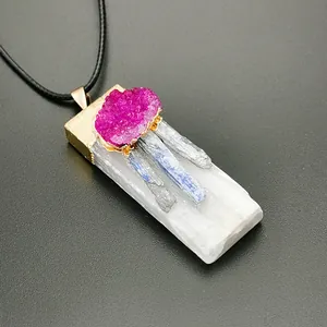 Detail of natural gypsum crystal pendant with rose pink cluster and gold-plated edges