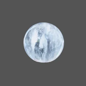 Spherical natural quartz crystal stone with internal cloud texture on dark background
