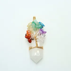 Close-up of tree of life wire-wrapped crystal pendant with multi-color chakra stones