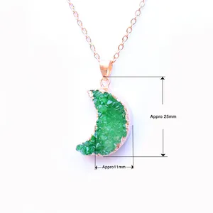 Macro shot of a 25mm moon-shaped green druzy quartz pendant with rose gold trim