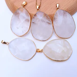 Faceted amethyst crystal pendants with gold-plated copper edges and natural ice textures