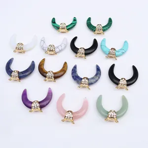 Horn-shaped natural stone pendants with crystal accents and gold-plated hardware