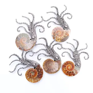 Set of five vintage silver octopus pendants featuring natural ammonite fossil stones