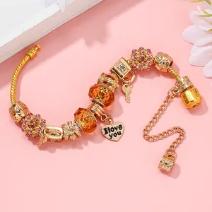 Goldenes Charm-Armband mit Herzanhänger, Kronenperle und Schlangenkette für Damen