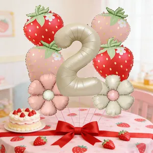 Champagne gold number 2 balloon set with strawberry and daisy designs for birthday party
