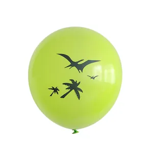 Detail of 12-inch green latex balloon with black pterodactyl and coconut tree prints