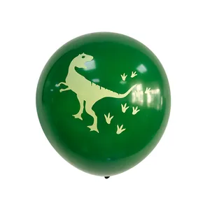 Detail of 12-inch dark green latex balloon with yellow dinosaur and footprint prints