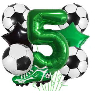 Detail view of soccer party balloon set featuring green number five and sports shoe balloons