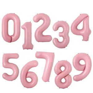 Macro view of matte pink 0-9 foil number balloons for birthday party decorations