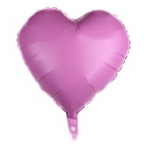 Detailed close-up of pink-purple heart foil balloon with metallic reflective finish
