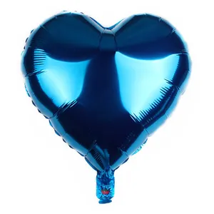 Close-up of heart-shaped blue foil balloon with metallic finish and inflation valve