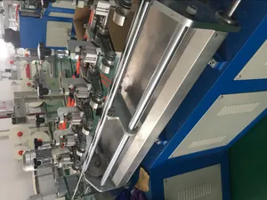 Detail of mechanical rollers and pneumatic parts of an industrial paper straw making machine