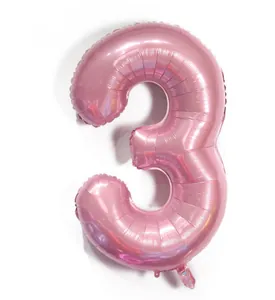Detail of pearlescent pink foil number 3 balloon with metallic luster and inflation port