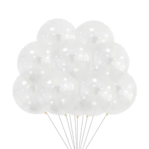 Close-up of clear 12-inch latex balloons with white snowflake prints and holder sticks