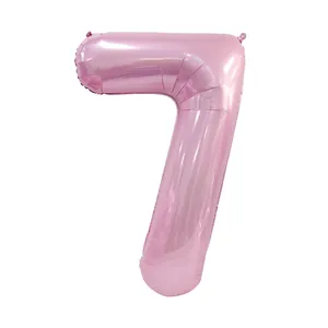 Macro detail of number 7 pink foil balloon with glossy metallic finish for party decor