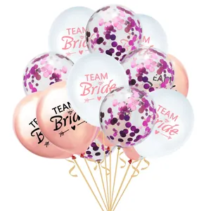 Close-up of Team Bride balloons in rose gold and white with confetti for wedding party