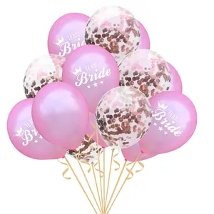Detailed shot of pink Team Bride balloons and transparent rose gold confetti balloons