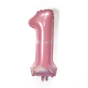 Detailed view of number 1 pink foil balloon with smooth metallic texture for parties
