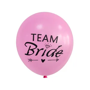 Detailed view of pink Team Bride latex balloon with black diamond and heart graphics