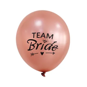 Close-up of rose gold Team Bride latex balloon with metallic finish and heart design
