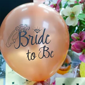 Detail of rose gold Bride to Be latex balloon with elegant black script and crown