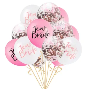 Detail of Team Bride rose gold confetti balloons with silk ribbons for wedding parties