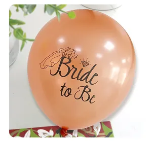 Detail of rose gold Bride to Be latex balloon with elegant wedding diamond ring icons