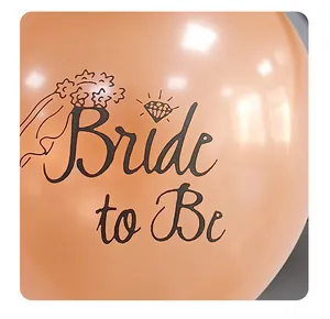 Detail of rose gold Bride to Be latex balloon with diamond ring and veil print