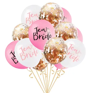 Detail of Team Bride rose gold confetti and latex balloon cluster with curling ribbons