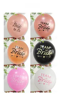 Close-up of rose gold Team Bride latex balloons with elegant prints for wedding parties