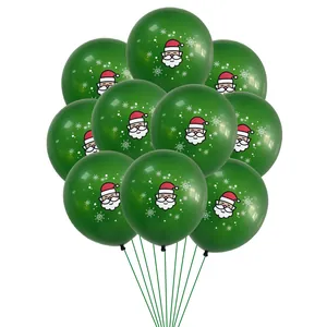 Detail of 12-inch dark green latex balloons with Santa Claus and snowflake prints