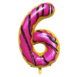 Detail of 40 inch donut number 6 foil balloon with pink frosting for party decor