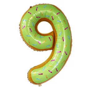 Detail of 40-inch number 9 donut foil balloon with green icing and colorful sprinkles