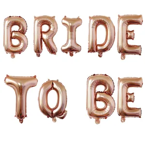 Detailed view of rose gold foil balloons spelling BRIDE TO BE for wedding party decor