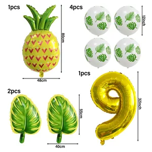 Détail du set de fête Hawaï avec ballons ananas, feuilles et ballon chiffre 9
